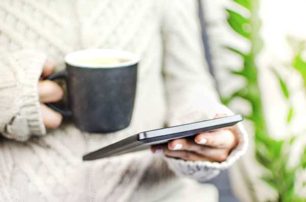 Reading an eBook with a coffee